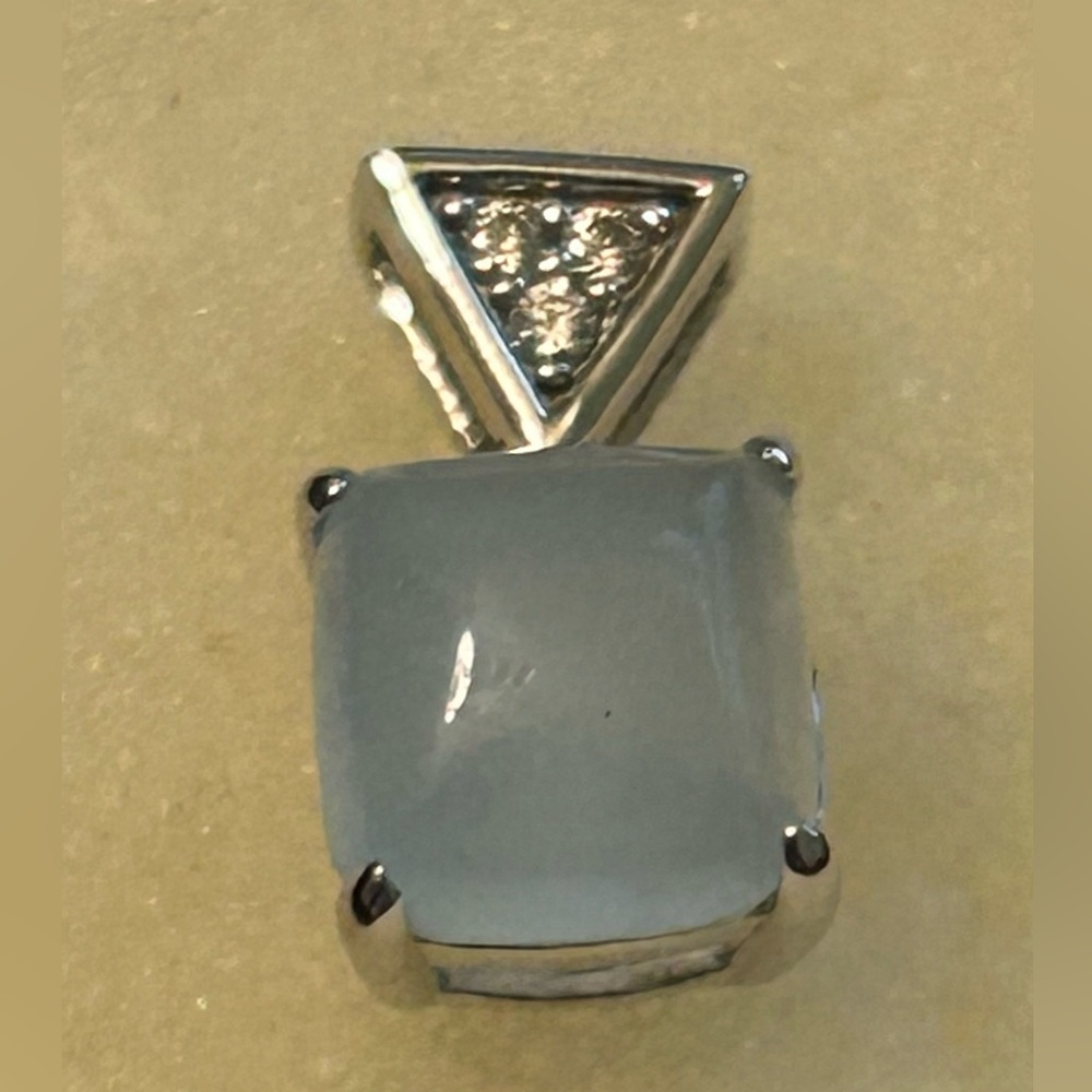 Dainty 925 genuine aquamarine and CZ pendant. 5/8 of an inch by 3/4 of an inch